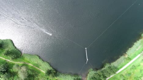 Aerial-drone-shot-of-a-wakeboarding-at-a-watersport-park