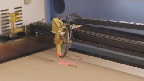 cnc laser cutting machine cuts wooden plank and plywood