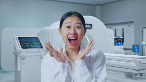 close up of asian woman doctor showing gesture hands palm, saying wow, and smiling with mri machine in the hospital