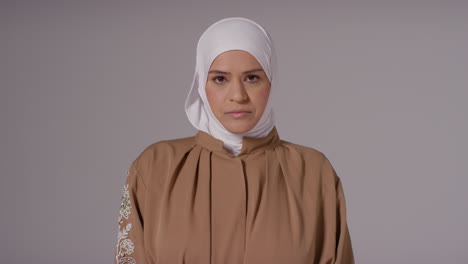 studio portrait of muslim woman wearing hijab against plain background 6