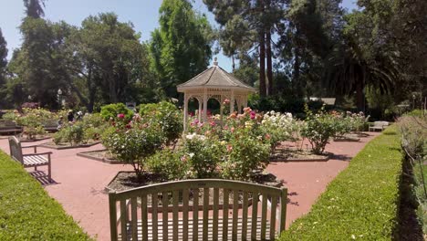 Behind-Bench-Shot-Of-Stunning-Gazebo-At-Colorful-Central-Park-Of-San-Mateo,-California