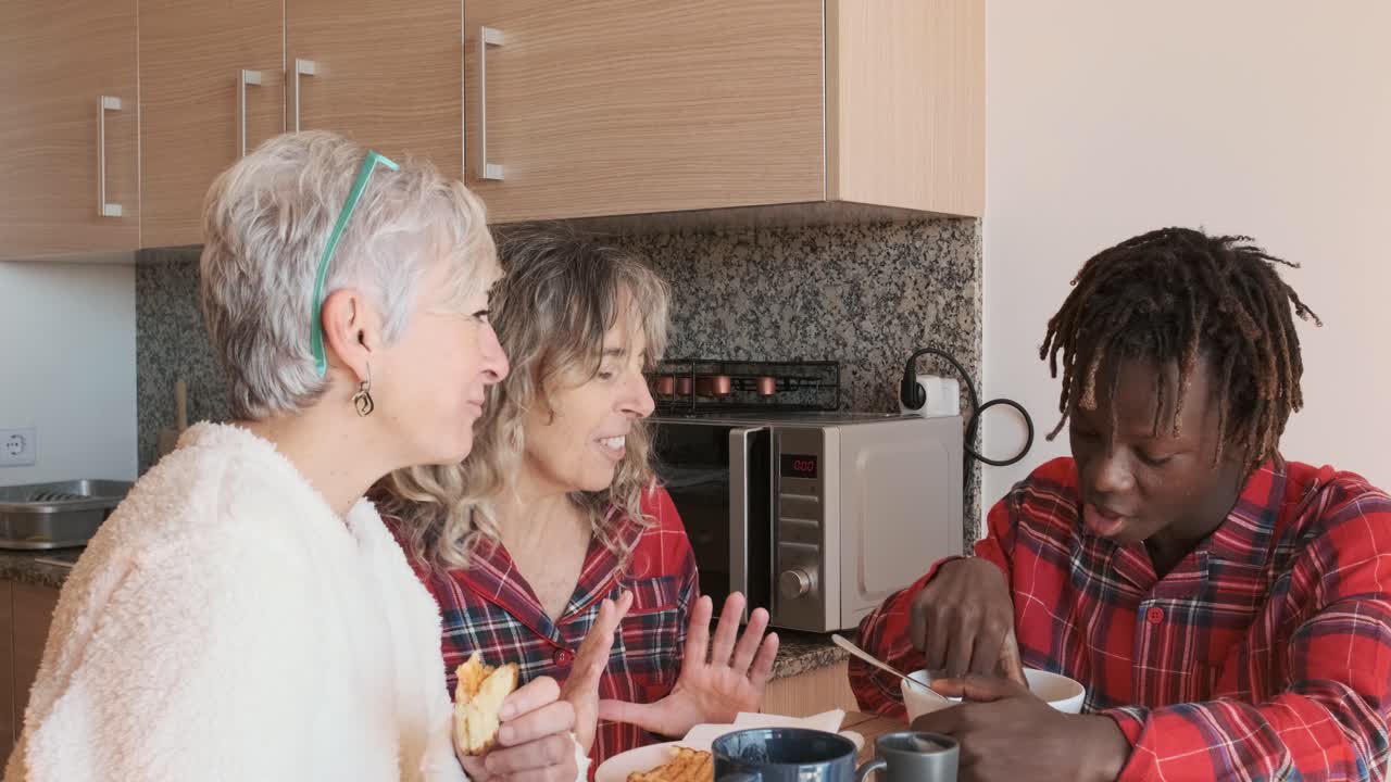 People having breakfast in the kitchen