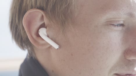 person wearing wireless earbuds