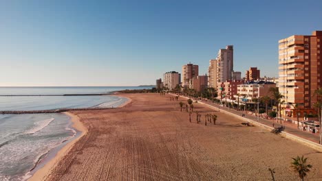 sun is shining on empty spanish beach