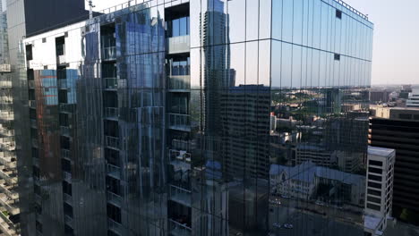 modern glass skyscraper with cityscape reflections