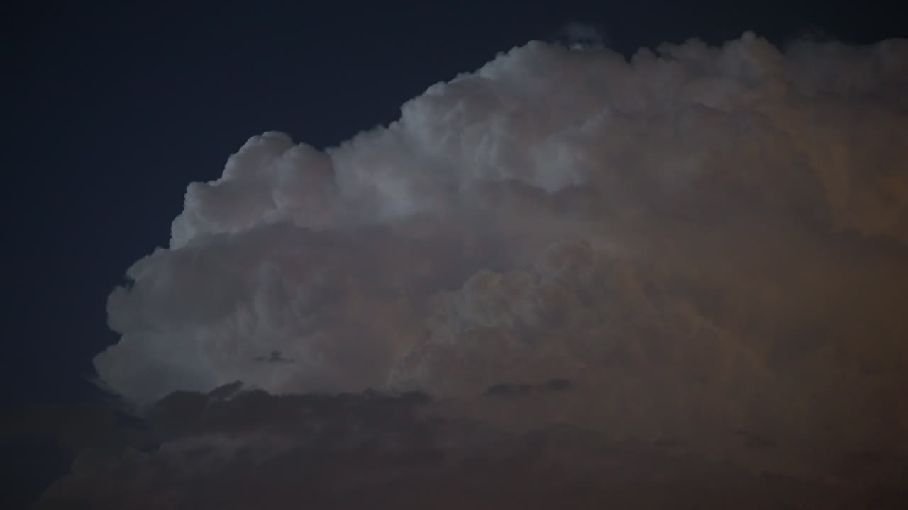 Flashing lightning strikes captured overhead late at night