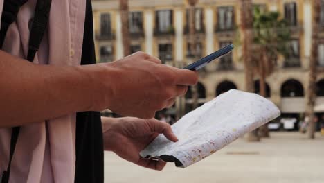 man tourist using smart phone searching location in map application online close up macro. backpacker using gps to find destination on vacation. city or forest hiking, walking in europe