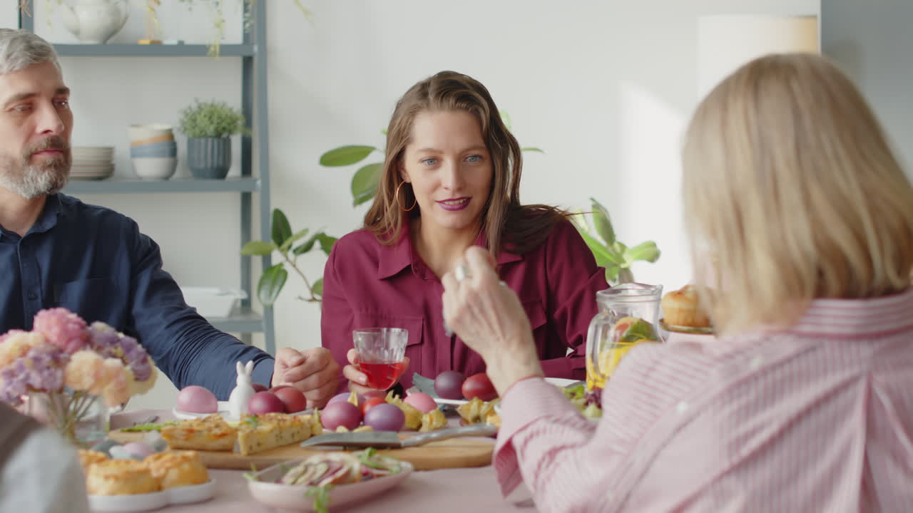 Family Couple Chatting with Grandparents on Easter Dinner