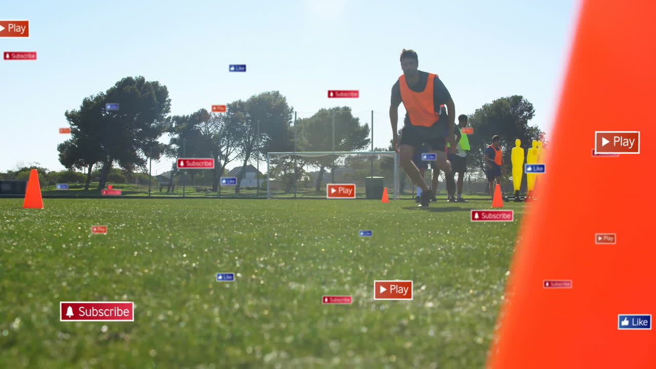 Training on field, soccer players with animation of digital play and subscribe icons