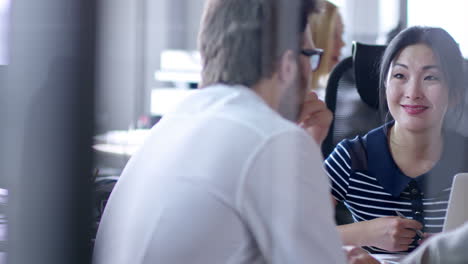 Businesswoman-Sitting-In-A-Desk-Attends-And-Advises-Two-Businessmen-Dressed-In-Elegant-Clothes-In-Office