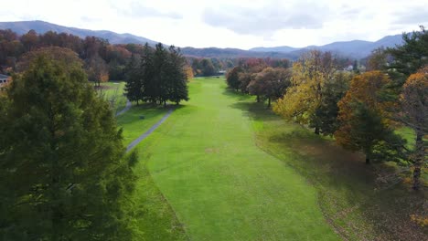 Aerial-shot-flying-down-fairway-on-golf-course-at-The-Greenbrier-during-autumn