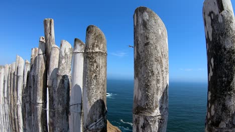 Wood-fence-at-the-top-of-an-island-in-the-pacific-ocean