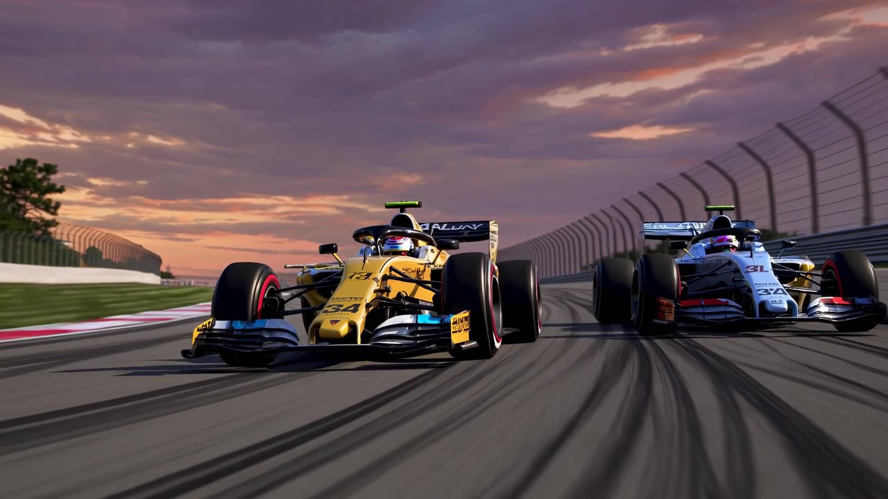 To Formel 1-racerbiler som konkurrerer på en bane ved solnedgang