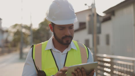 engineer working outdoors with a tablet