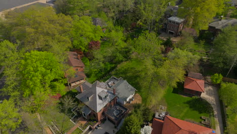 aerial over university city houses with a tilt up to reveal city hall and government buildings on a pretty spring day in st