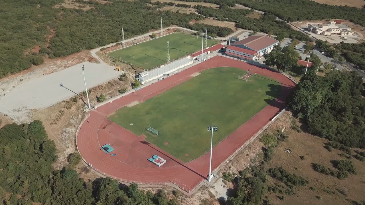 Aerial View of Sports Complex with Running Track and Soccer Fields