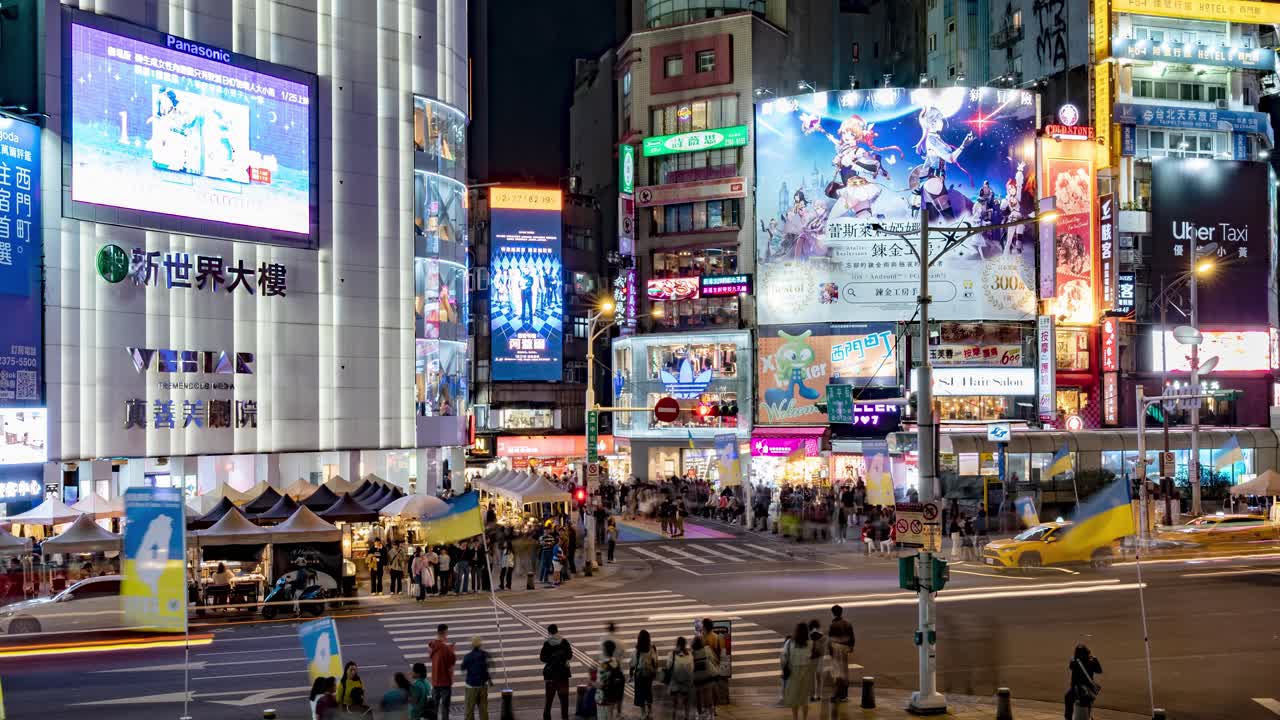 Timelapse of a busy crossing of Taipei Cityscape with Neon Lights, Traffic, and People at Night in Ximen District, Taiwan