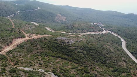 Aerial-view-of-vehicles-driving-on-a-mountain-road-in-Albania