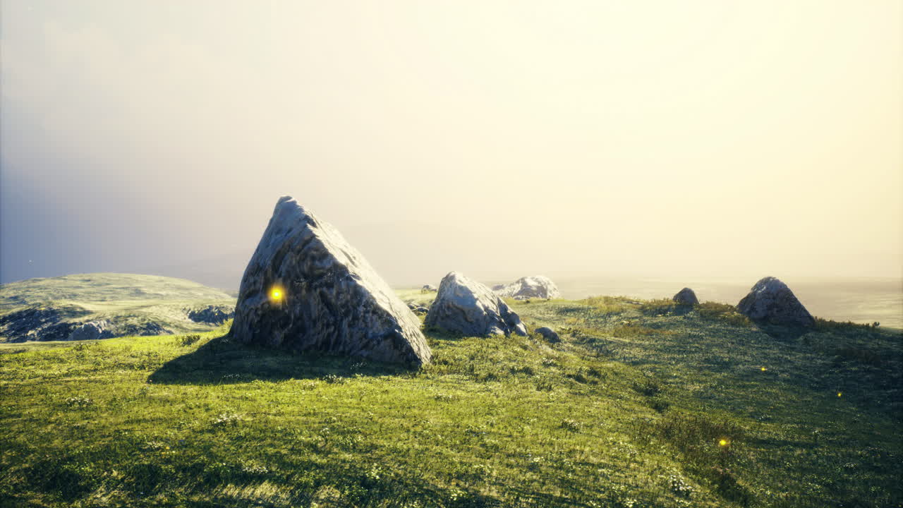 Sunlight illuminating rocky landscape with vibrant greenery at twilight