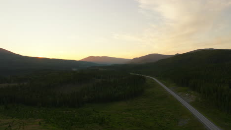 route e6 with midnight sun during the summer in northern norway, europe