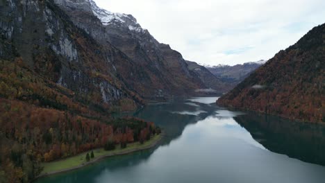 Aerial-clip-of-the-lake-view-between-the-mountain-summits-with-snow-caps