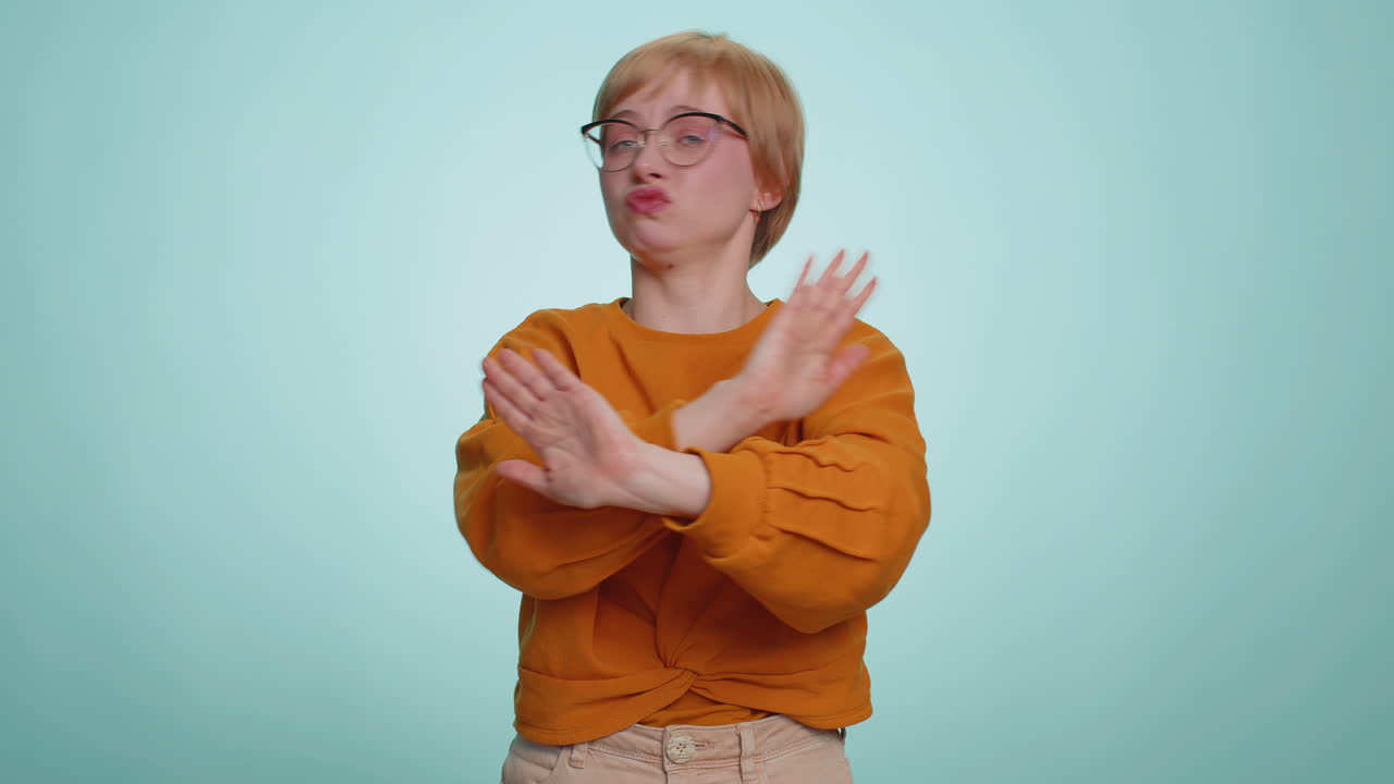 Annoyed irritated young woman covering ears gesturing no avoiding advice ignoring noise loud voices