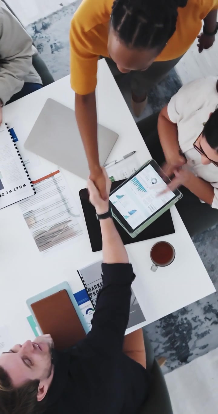 Diverse Business Team Shaking Hands During Office Meeting
