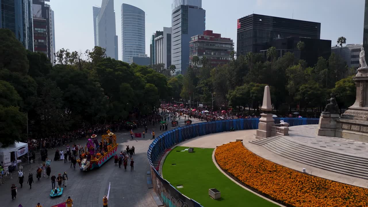 Panoramic aerial shot of Paseo de la Reforma during the traditional Day of the Dead parade in Mexico City