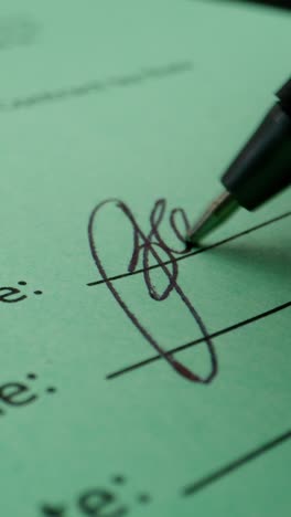 person signing a document