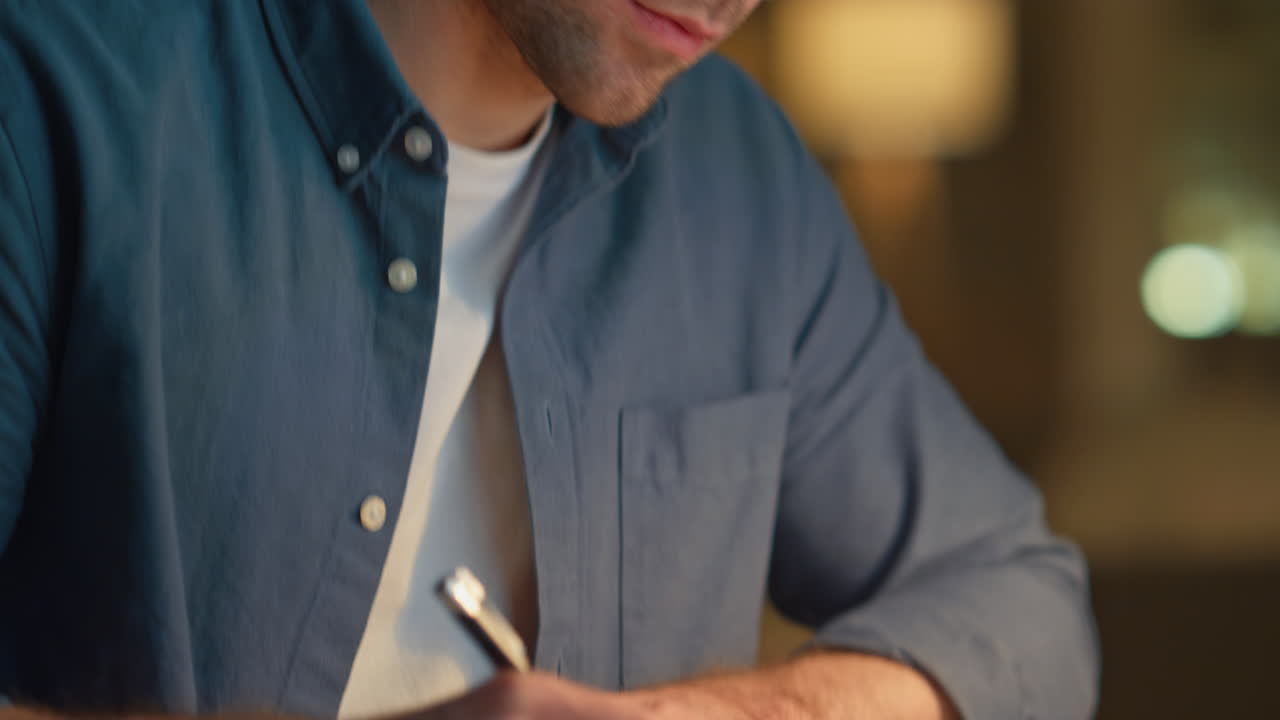 Involved man staring pc working late in home office closeup. Guy making notes