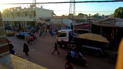 busy street scene in an african city at sunset