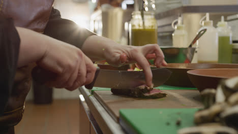 Caucasian-woman-cutting-meat