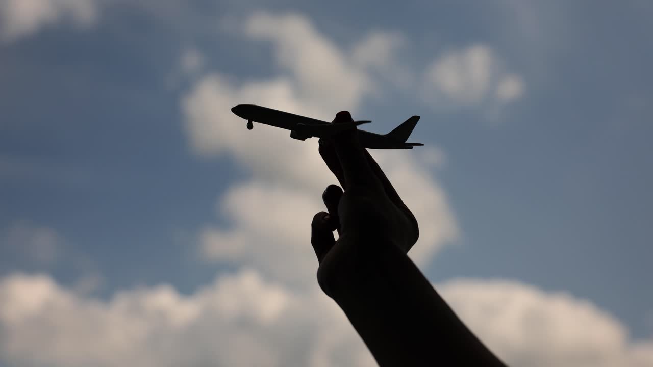 Toy Airplane Against Cloudy Sky