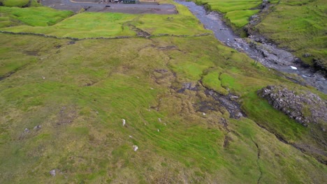 reveal of kvivik village in a green valley on streymoy