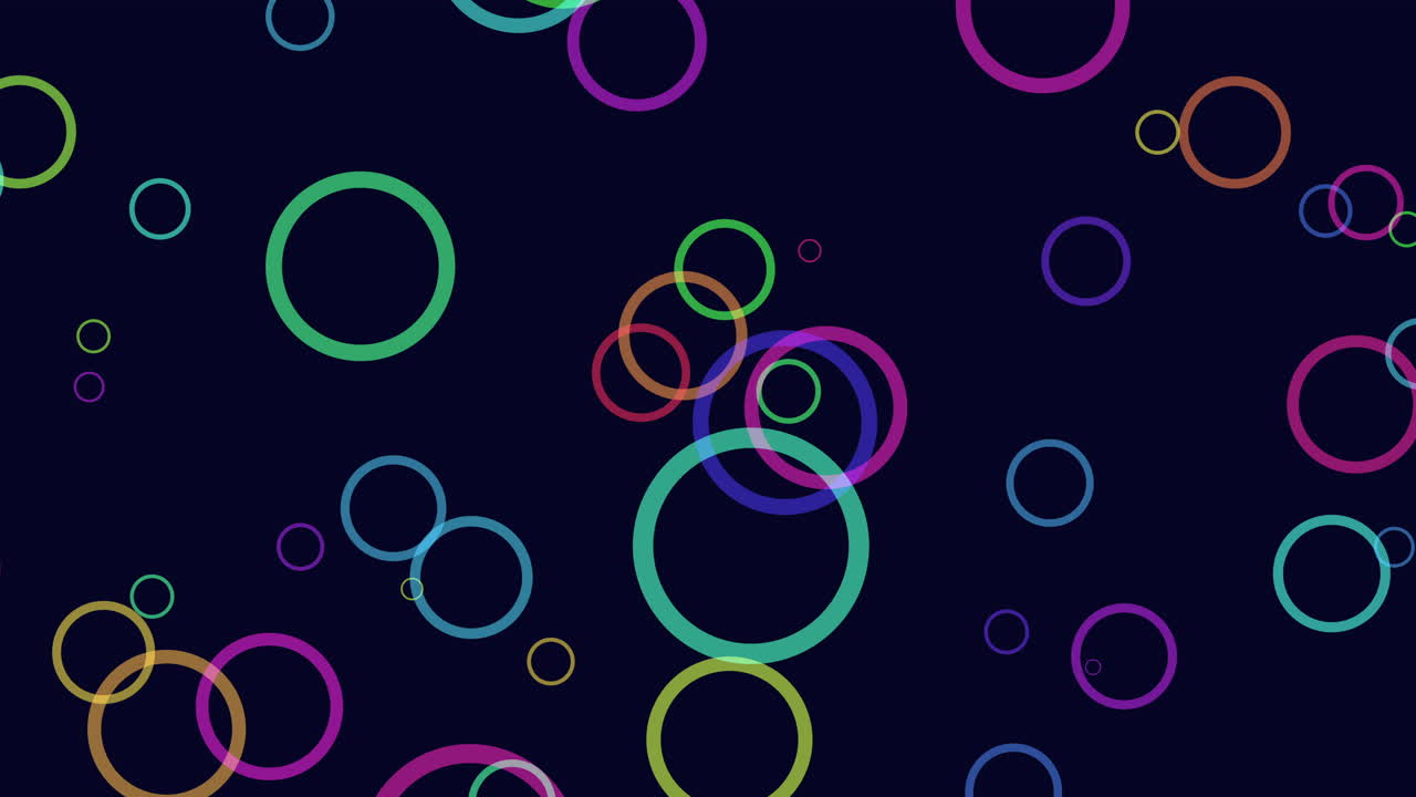 los círculos vibrantes forman un patrón colorido sobre un fondo oscuro.