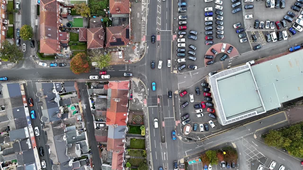 Aerial drone birds eye view of traffics cars vans trucks at the junction intersection sunderland england uk british streets