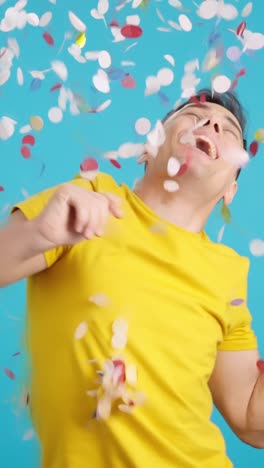man celebrating with confetti