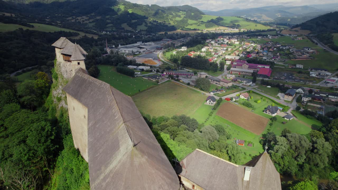 Aerial View of a Medieval Castle in a Mountain Valley