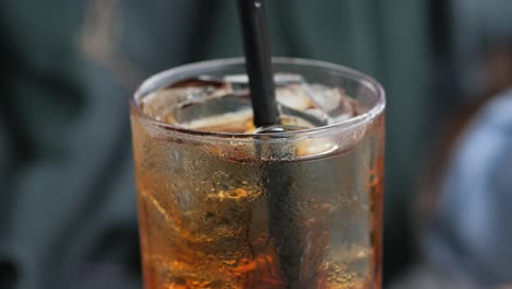 Cold-green-tea-in-a-glass-on-table-,