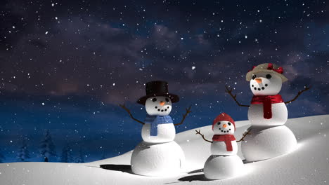 Animation-of-snow-falling-over-snowmen-in-winter-scenery