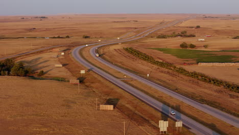 highway through the plains at sunrise/sunset