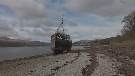 static ground-level shot of thecorpach shipwreck on the shores of fort william