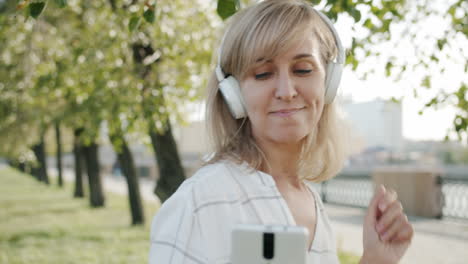 woman taking a selfie in a park