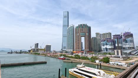 boats docked near tall buildings and clear water