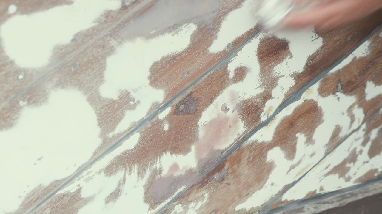 Cleaning sanded dust off mahogany boat hull planks