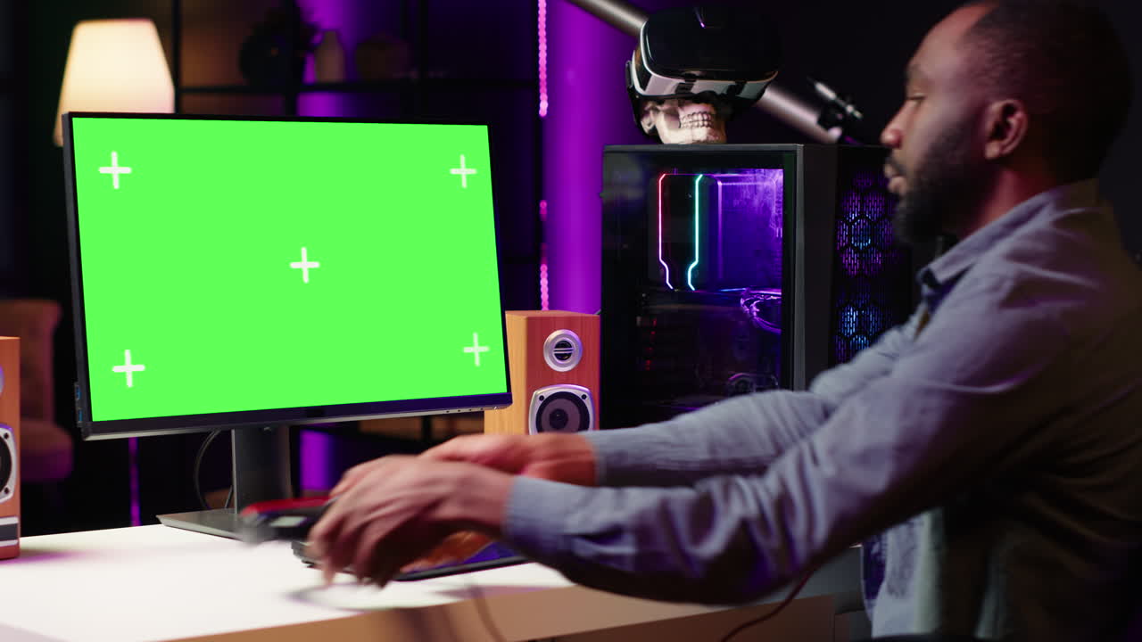 Gamer plays videogame on gaming PC isolated screen monitor