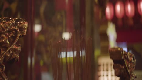 incense burning in a buddhist temple in taiwan, taipei