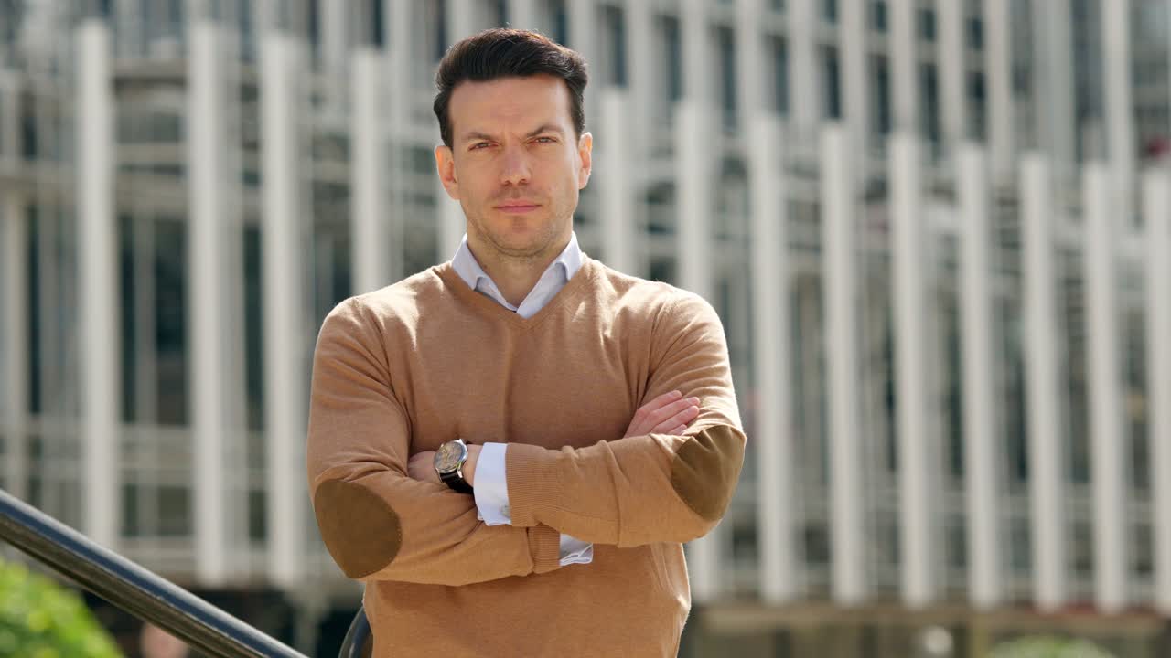 Portrait of a Man in a Sweater Standing Outdoors