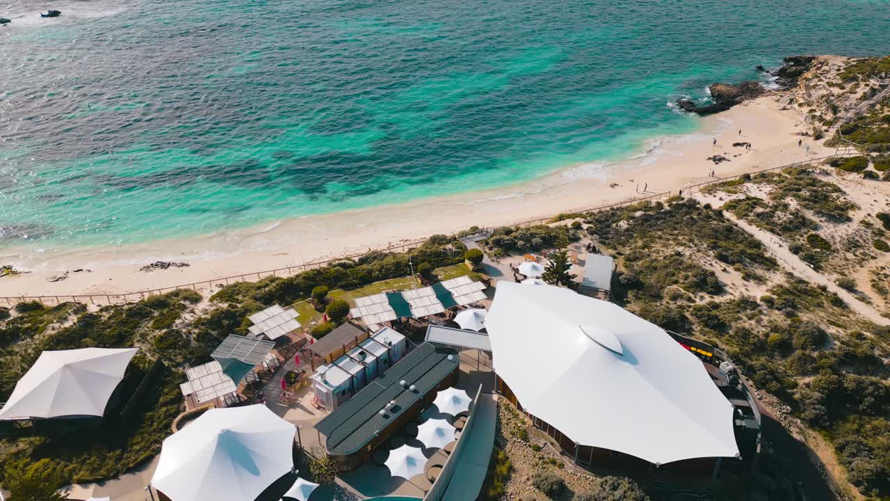 Stunning aerial footage of Rottnest Island, panning from the Pinky's Beach Club to the Bathurst Lighthouse to the rest of the island