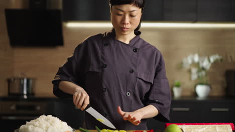 asian chef preparing sushi